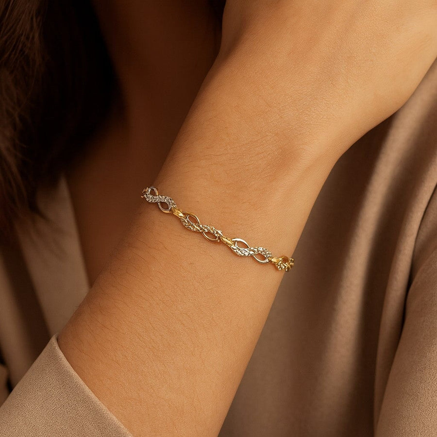 10KT Gold Infinity Bracelet Bracelet Bijoux Signé Luxo 
